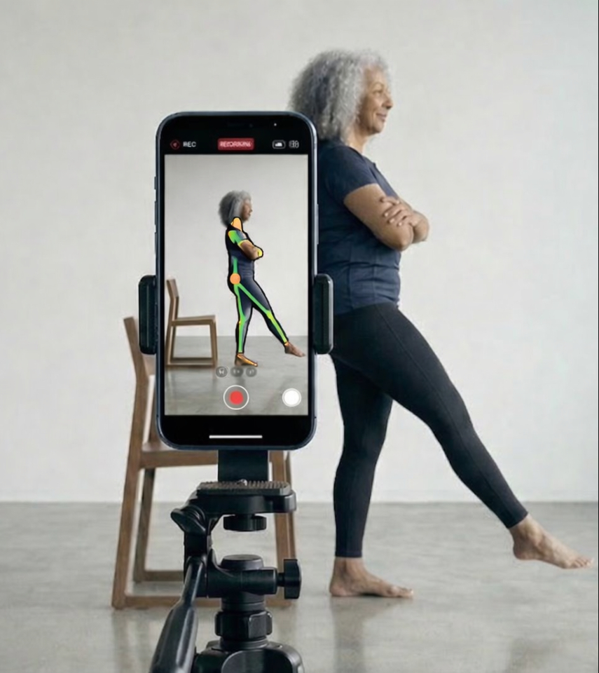 Member filming their own movement assessment at home with performance score on app screen